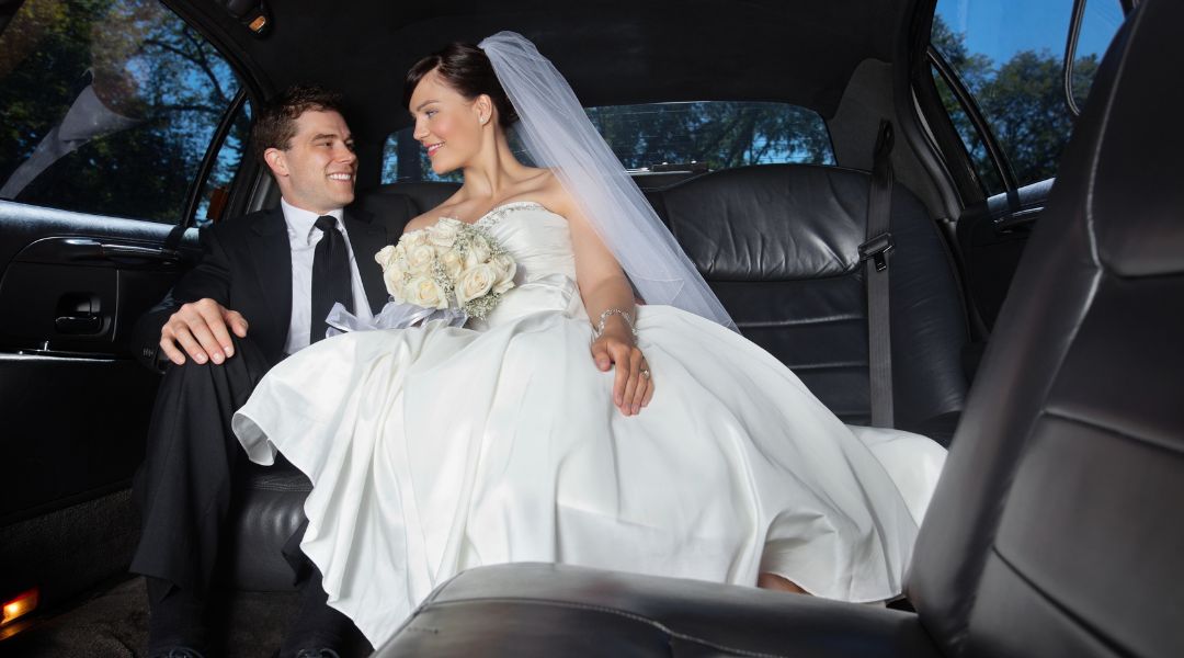 bride and groom in limo